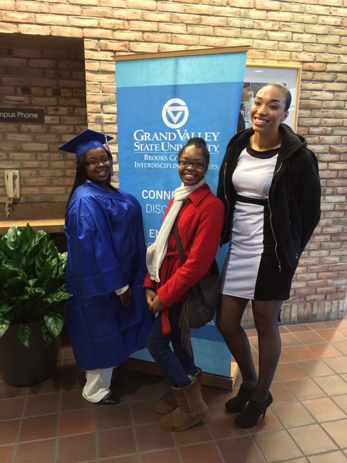 A graduate poses with her friends